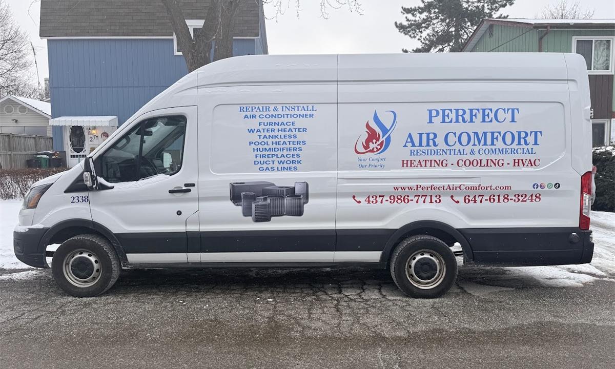 White Perfect Air Comfort van with the company name, services and phone numbers on the side